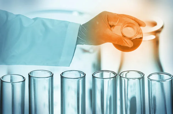 Scientist hand holding test tubes — Stock Photo, Image