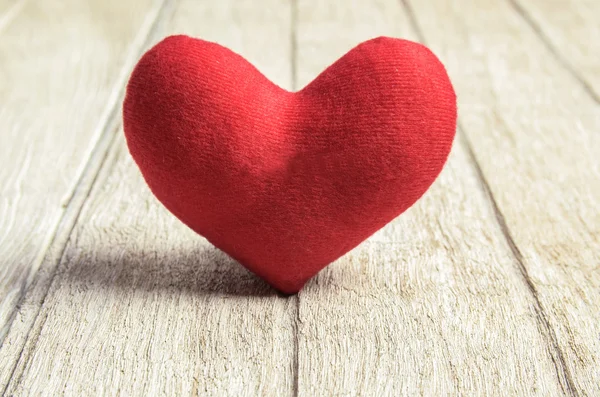 Red heart shape on wood background — Stock Photo, Image