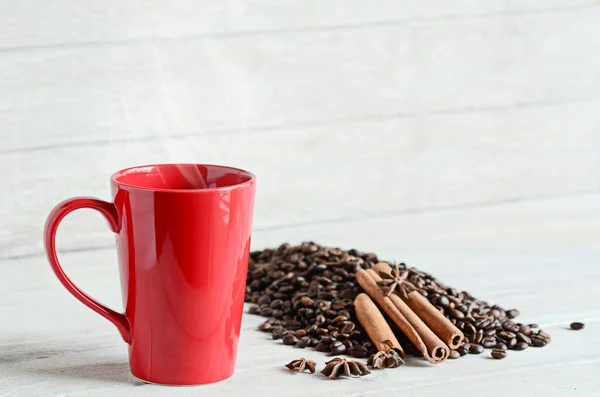 Red coffee cup on wooden table — Stock Photo, Image