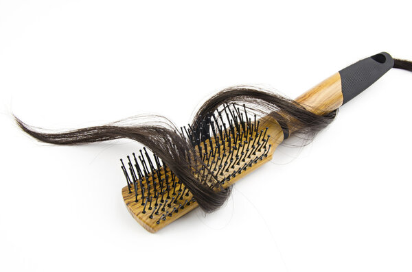 hair brush with long hair on white background