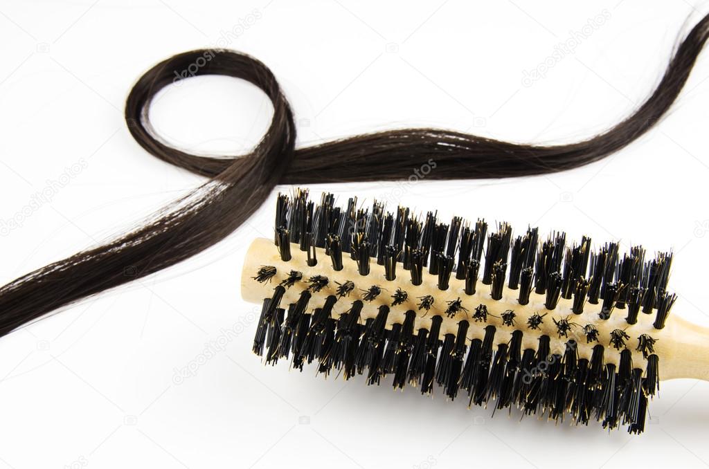 hair brush with long hair on white background