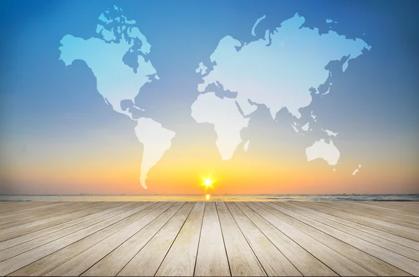 Wooden floor with world map and sunrise background — Stock Photo, Image