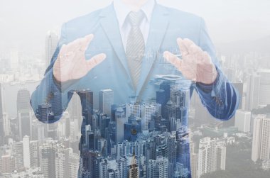 iş adamı modern bina arka plan ile çift pozlama