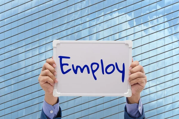 business man hand holding white board with text 