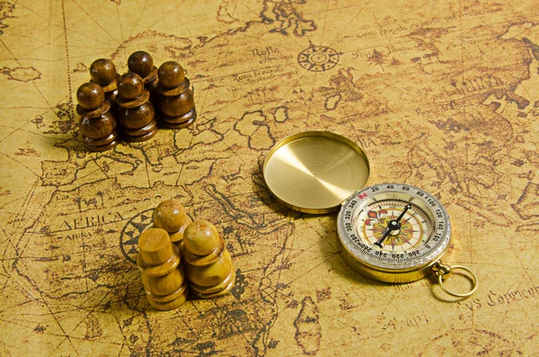 Compass and Chess on old map — Stock Photo, Image