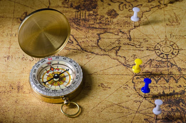 Compass and Chess on old map Stock Photo by ©kwanchaidp