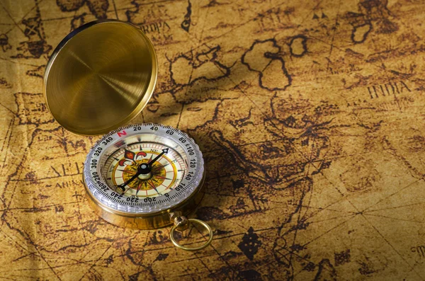 Compass and Chess on old map Stock Photo by ©kwanchaidp 75914687