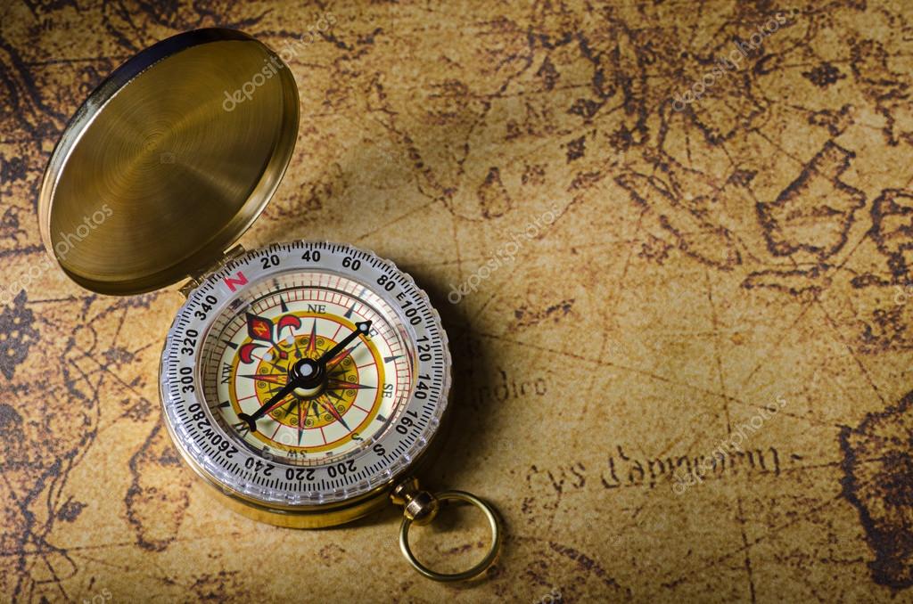 Compass and Chess on old map Stock Photo by ©kwanchaidp