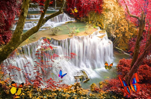 Deep forest Waterfall with artificial butterfly — Stock Photo, Image