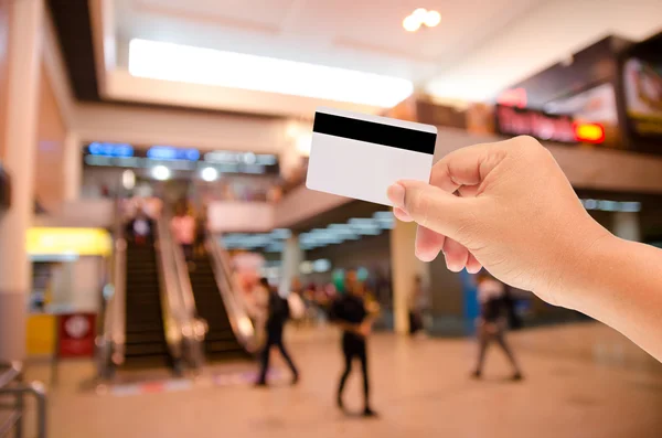 Hand holding a blank smart card on blur background — Stock Photo, Image