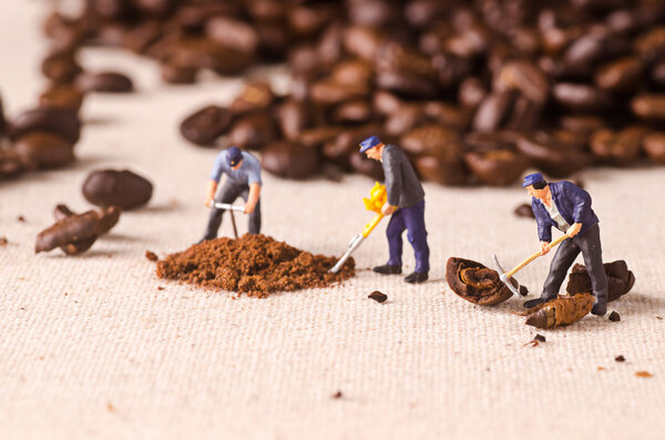 Miniature people working on coffee blend process