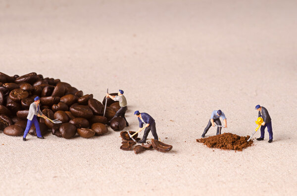 Miniature people working on coffee blend process