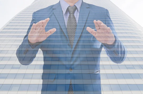 Business man with modern building background — Stock Photo, Image