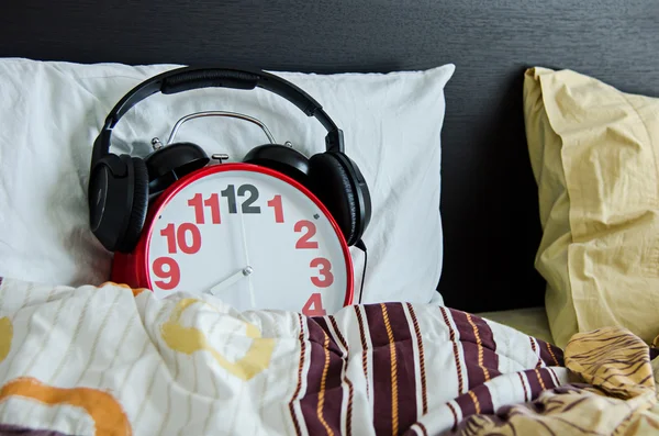 Alarm clock sleeping in bed — Stock Photo, Image