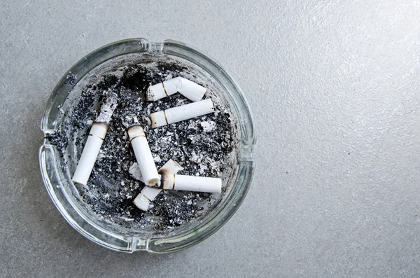 Ashtray with full of smoked cigarettes — Stock Photo, Image