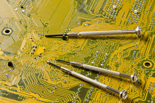 screwdriver on circuit board