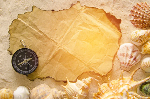 Compass on burn paper and sand backgroud — Stock Photo, Image