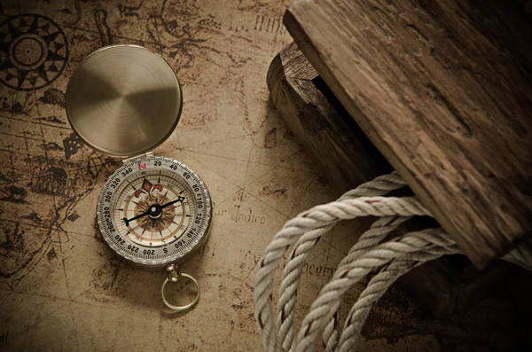 Compass and Chess on old map Stock Photo by ©kwanchaidp 75914583