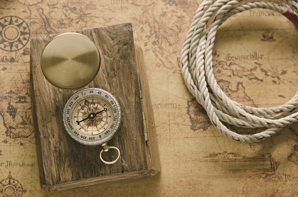 Compass and Chess on old map Stock Photo by ©kwanchaidp 75914739