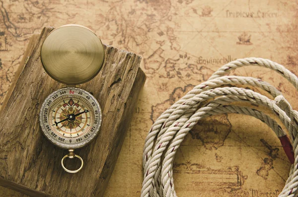 Compass and Chess on old map Stock Photo by ©kwanchaidp 75914739