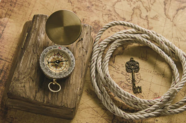 Compass and Chess on old map Stock Photo by ©kwanchaidp 75914583