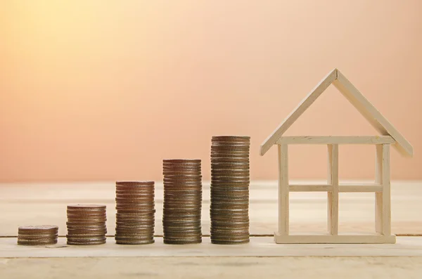 Stack of coins on wooden table — Stock Photo, Image