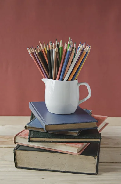 Color pencils on stack of book — Stock Photo, Image