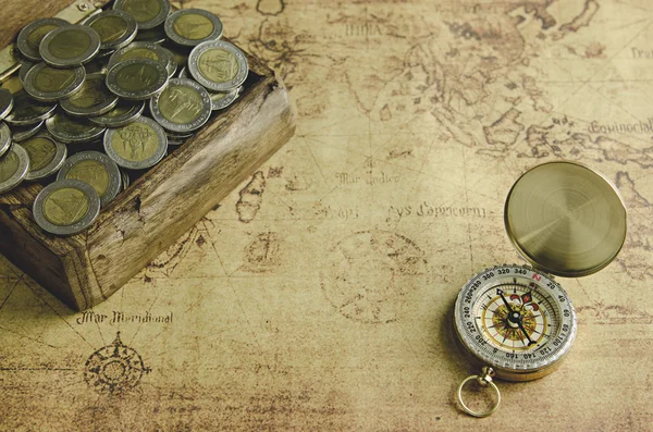 Compass and Chess on old map Stock Photo by ©kwanchaidp 75914687