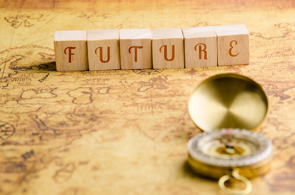 Wood cubes with word Future on an Old Map