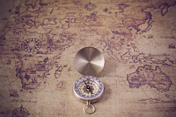 Compass and Chess on old map Stock Photo by ©kwanchaidp 75914687