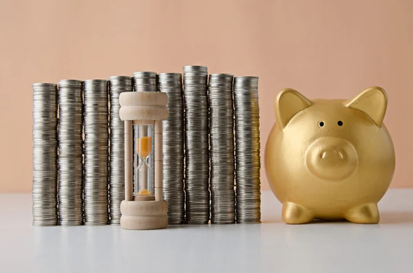 Coin stack with compass and piggy bank , Saving plan — Stock Photo, Image