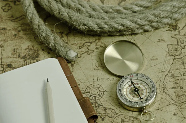 Compass and Chess on old map Stock Photo by ©kwanchaidp