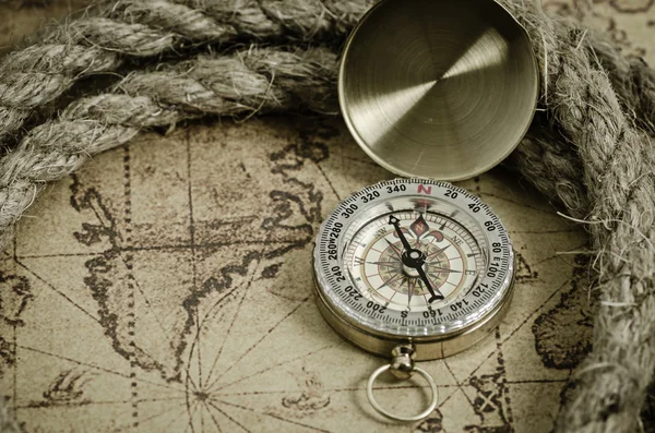 Compass and Chess on old map Stock Photo by ©kwanchaidp 75914583