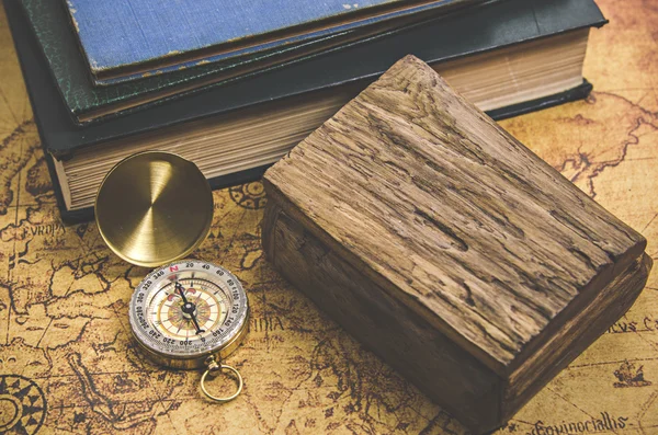 Compass and Chess on old map Stock Photo by ©kwanchaidp 75914687