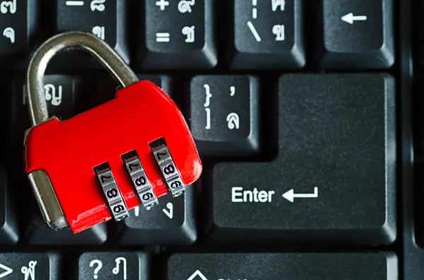 Red metal security lock on keyboard — Stock Photo, Image