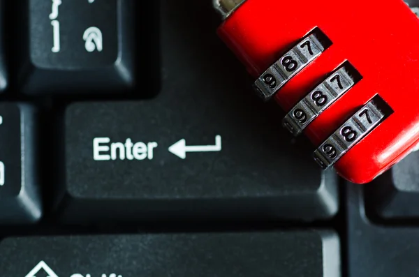 Red metal security lock on keyboard — Stock Photo, Image