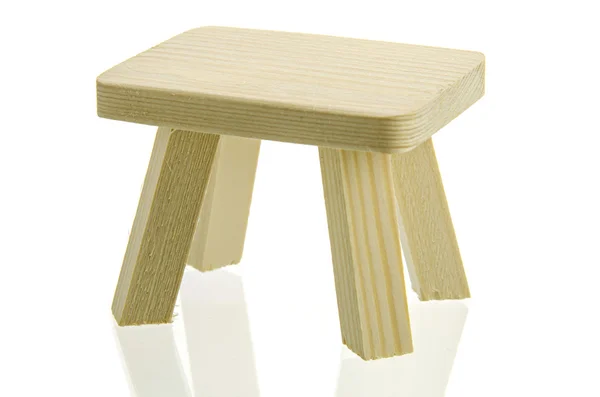 Mesa de madeira em miniatura isolada no fundo branco — Fotografia de Stock