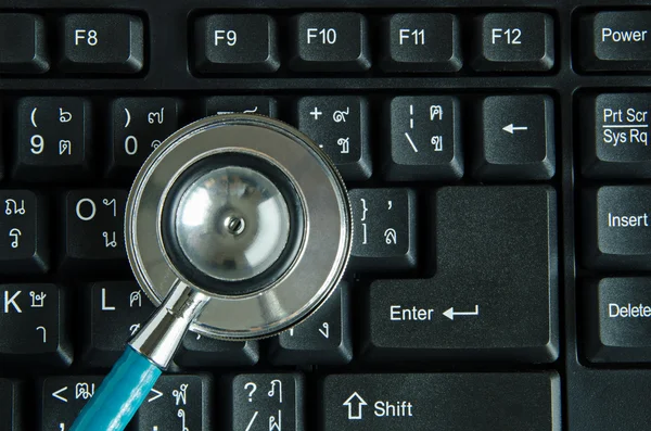 Stethoscope on keyboard — Stock Photo, Image