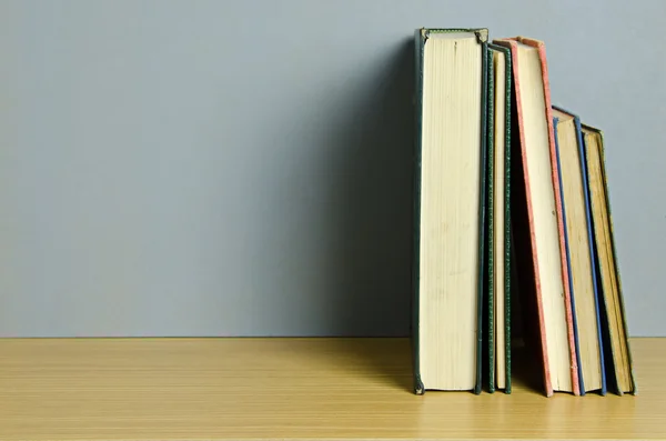 Book stack on table — Stok fotoğraf