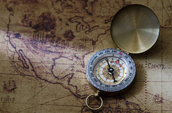 Compass and Chess on old map Stock Photo by ©kwanchaidp 75914739