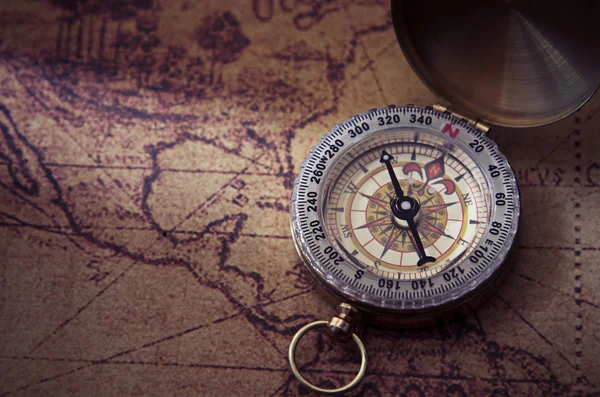 Compass and Chess on old map Stock Photo by ©kwanchaidp