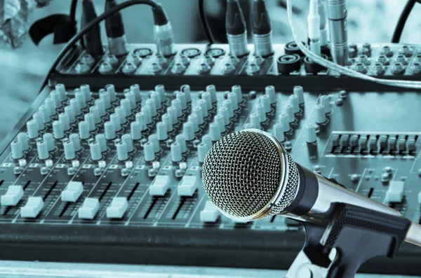 Microphone with mixing audio console background — Stock Photo, Image