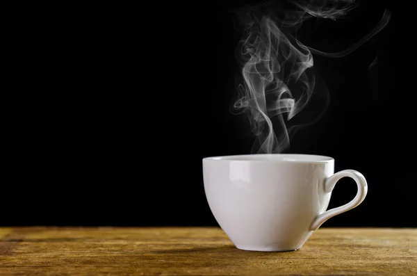 White coffee cup with smoke on black background — Stock Photo, Image