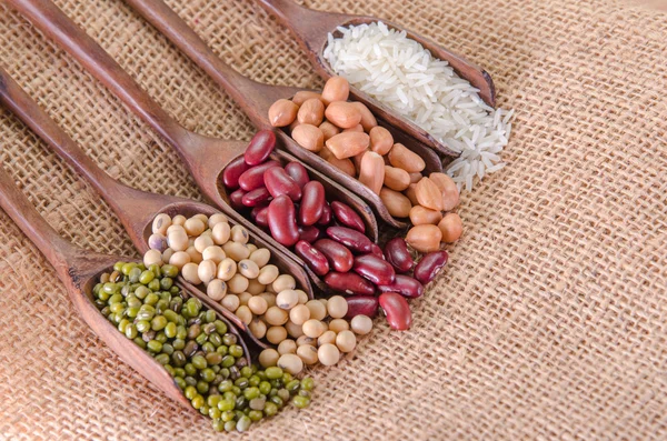 Many type of beans set in wooden spoon — Stock Photo, Image