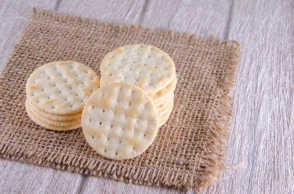 Stack of water cracker on wooden table — Stock Photo, Image