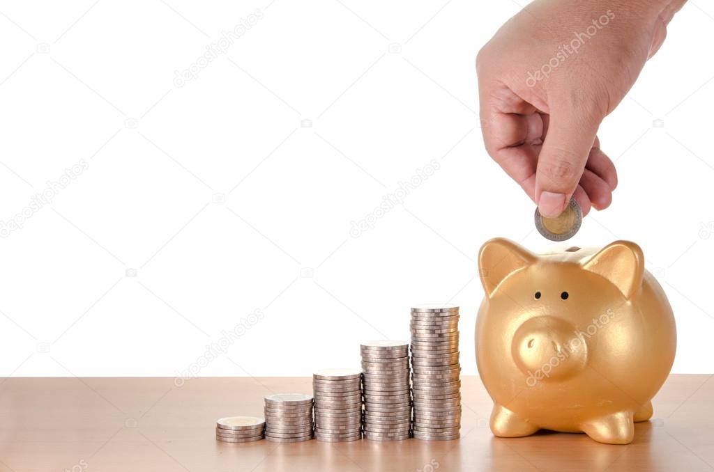 man hand with coins plan to saving money with gold piggy bank is