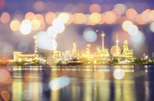 Double exposure of Oil refinery plant and city night bokeh — Stok fotoğraf