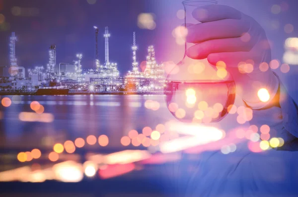 Double exposure of laboratory test tube and Oil refinery plant — Stok fotoğraf