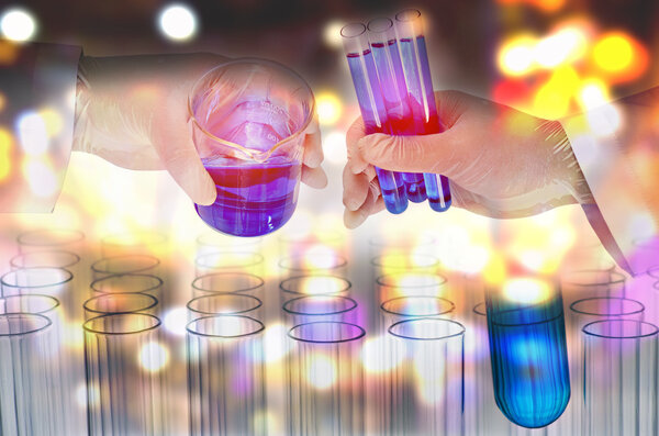 Double exposure of scientist hand holding laboratory test tube