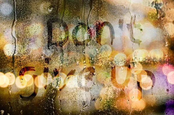 Natural water drops on glass window with word "Don't give up" — Stock Photo, Image